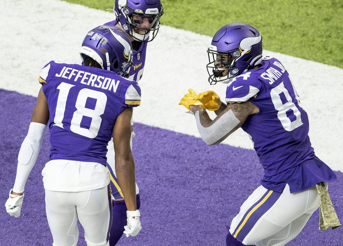 Minnesota Vikings tight end Irv Smith Jr. (84) celebrated with teammates Justin Jefferson (18) and Adam Thielen (19) after scoring a touchdown in the third quarter. ] CARLOS GONZALEZ ¥ cgonzalez@startribune.com Ð Minneapolis, MN, November 8, 2020, NFL, The Minnesota Vikings played the Detroit Lions at U.S. Bank Stadium in Minneapolis on Sunday, November 8, 2020.