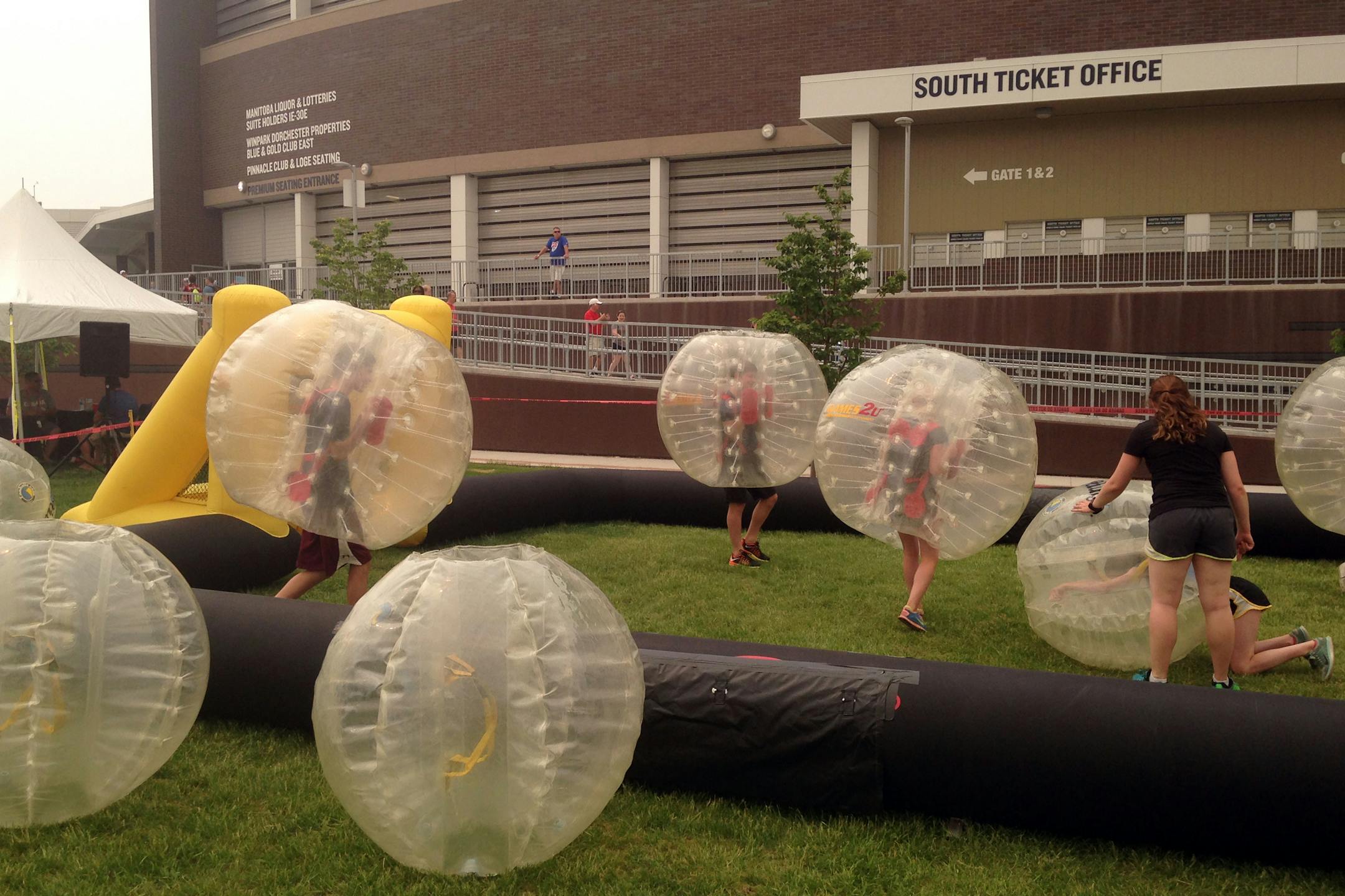 Outside Winnipeg Stadium, kids knocked each other over in bubble soccer matches before heading in to watch the Women's World Cup in Winnipeg, Manitoba in June 2015.