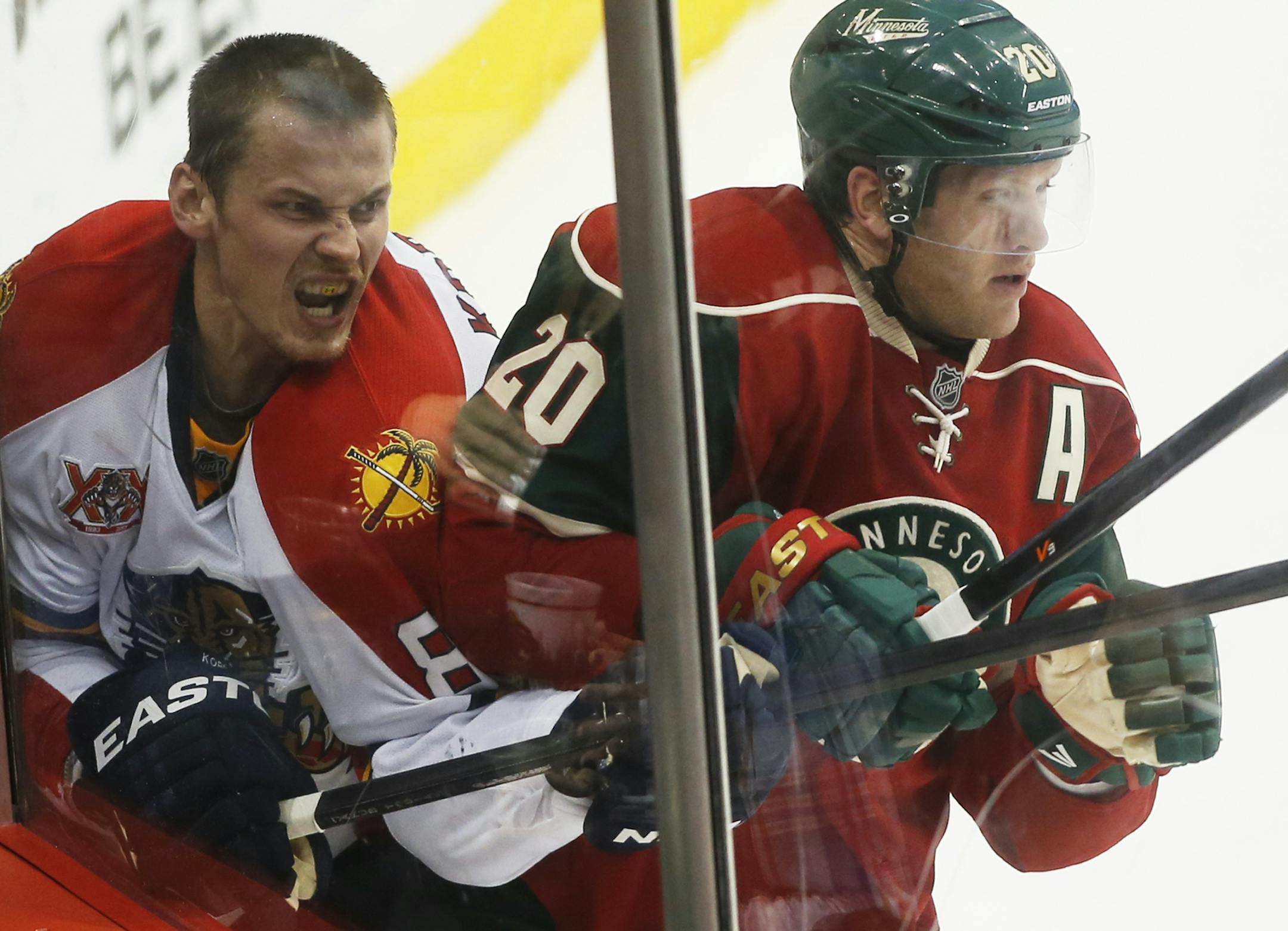 During the third period, Florida'sTomas Kopecky lost his helmut in the corner near the Minnesota Wild's Ryan Suter (20) during the Wild's 3-2 win at the Xcel Energy Center Friday, Nov. 15, 2013, in St. Paul, MN.](DAVID JOLES/STARTRIBUNE) djoles@startribune.com Florida at the Minnesota Wild at the Xcel Energy Center Friday, Nov. 15, 2013, in St. Paul, MN.]