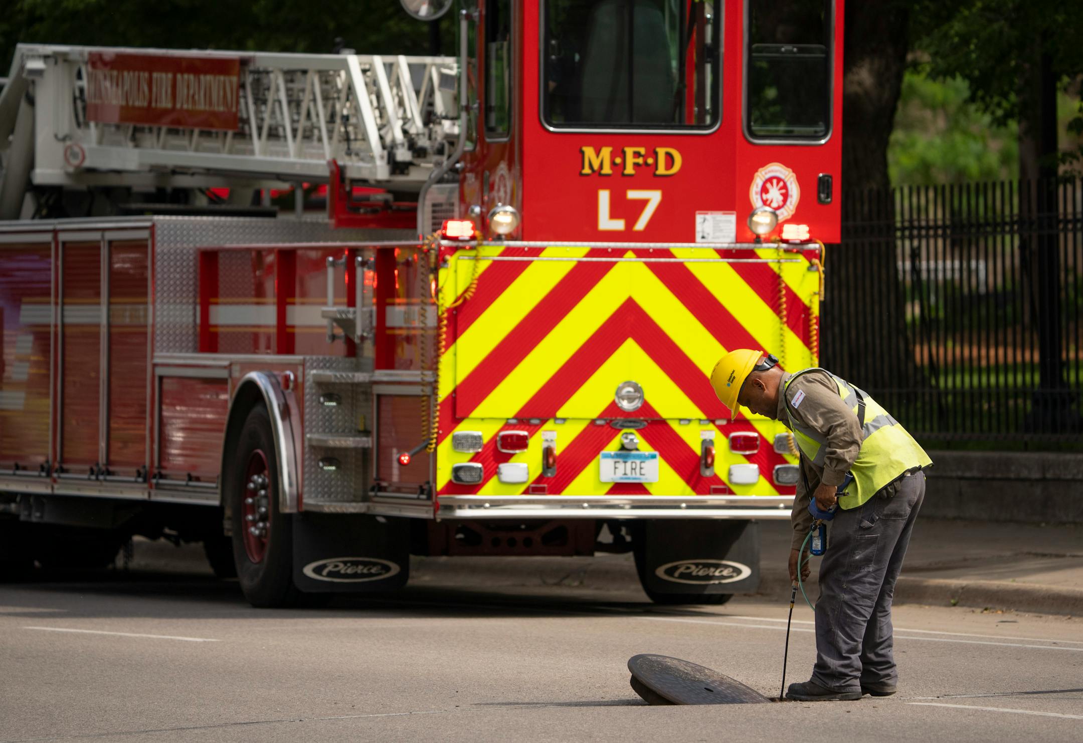 A CenterPoint Energy worker checked for natural gas in a sewer Thursday afternoon on University Ave. in Minneapolis. A suspected gas leak resulted in the evacuation of fraternity houses on University Ave. SE across from the U of M campus.