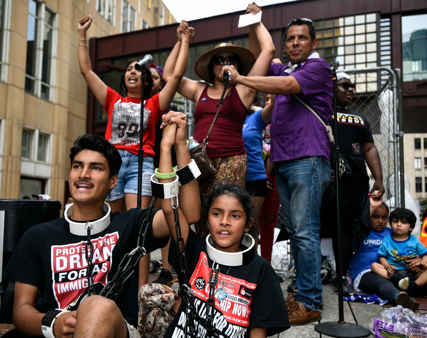 James Gutierrez, 15, and his sister, Lilah, 8, wore chains during Saturday's demonstration against the Trump administration's immigration policies. "We're here to stop them (children) from being put in cages." said James. On Trump's executive order to stop the separations, he says "That just means they&#xed;re all going to be put in the cage together." ] AARON LAVINSKY &#xef; aaron.lavinsky@startribune.com Thousands attended a demonstration against the Trump administration's immigration policies