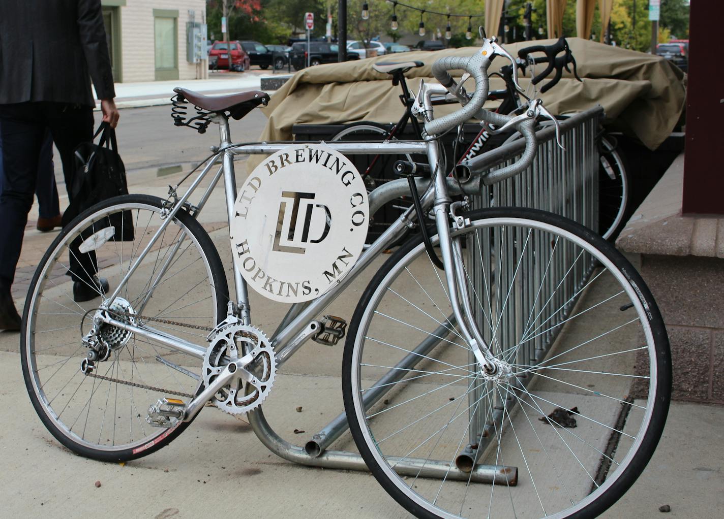 A bicycle featuring a logo of LTD Brewing in Hopkins helps attract attention to the business, located just off Mainstreet.