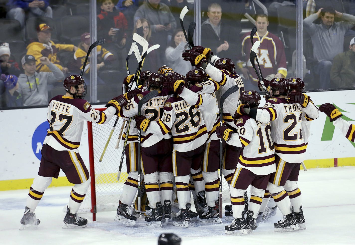 Minnesota-Duluth celebrates a 2-1 win over Air Force in an NCAA regional men's college hockey tournament game Saturday, March 24, 2018, in Sioux Falls, S.D. (AP Photo/Dave Eggen)