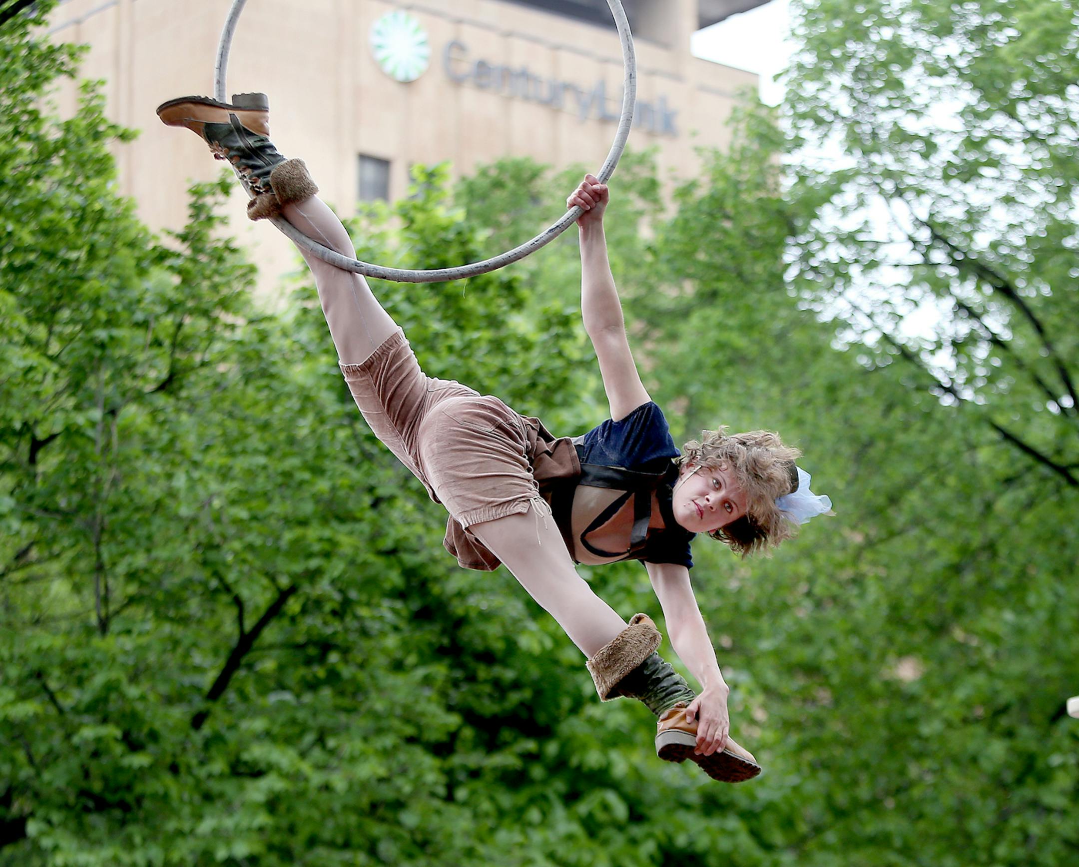 Hannah Bobzien, cq, performed above Washington Street on the lyra for the Cirque Mechanics' Gantry Bike performance during the 14th Annual Flint Hills International Children's Festival, Thursday, May 27, 2014 in St. Paul, MN. ] (ELIZABETH FLORES/STAR TRIBUNE) ELIZABETH FLORES • eflores@startribune.com