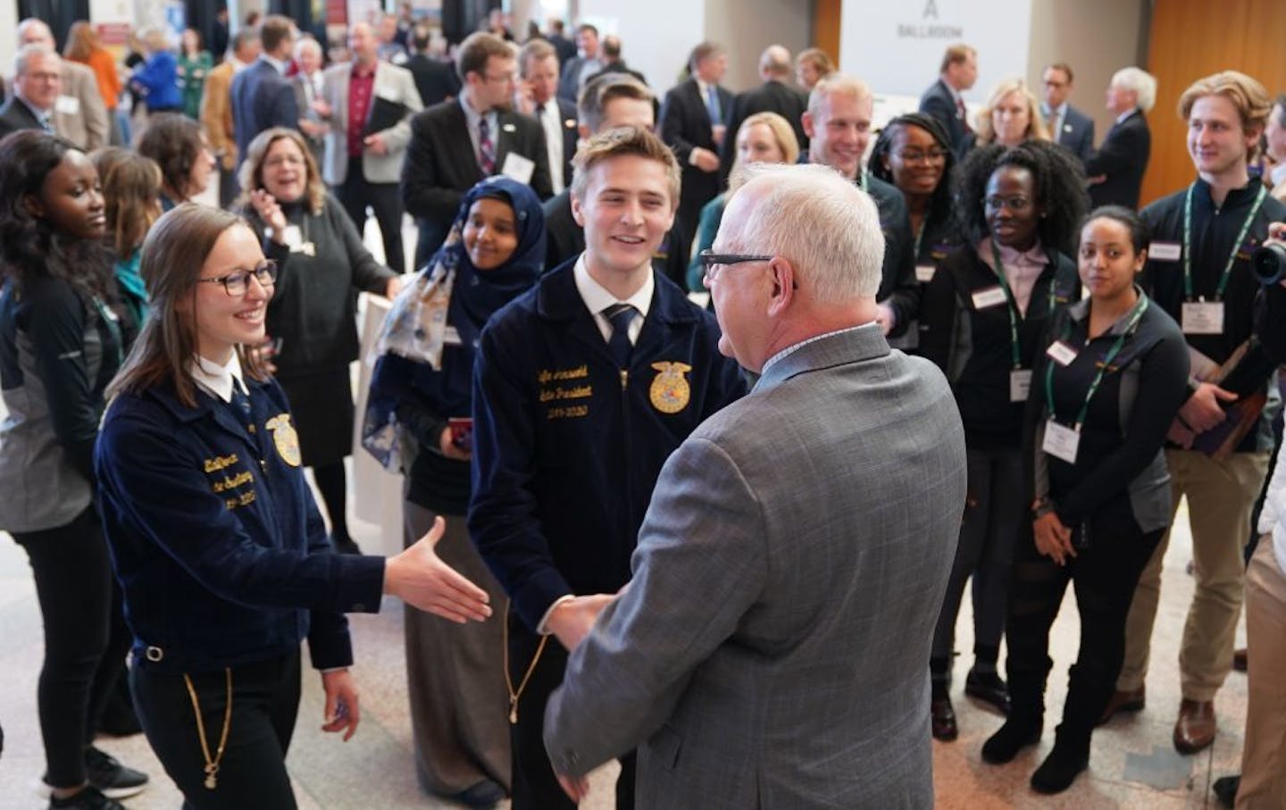 Governor Tim Walz talked with Future Farmers of America Minnesota state secretary Elaine Dorn and state president Lafe Arsvold before speaking at the MN Ag and Food Summit in Minneapolis. Earlier in the day the Governor requested a disaster designation be issued for several Minnesota counties so that farmers could access federal programs to help recover from recent weather events and losses.