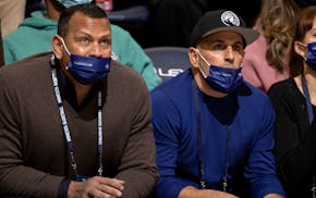 Minnesota Timberwolves co-owners Alex Rodriguez, left, and Marc Lore watched the Wolves play New Orleans at Target Center last month.