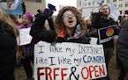 Lindsay Chestnut of Baltimore protested near the Federal Communications Commission in Washington on Thursday ahead of the vote on net neutrality.