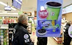 U.S. Immigration and Customs Enforcement agents serve an employment audit notice at a 7-Eleven convenience store Wednesday, Jan. 10, 2018, in Los Ange