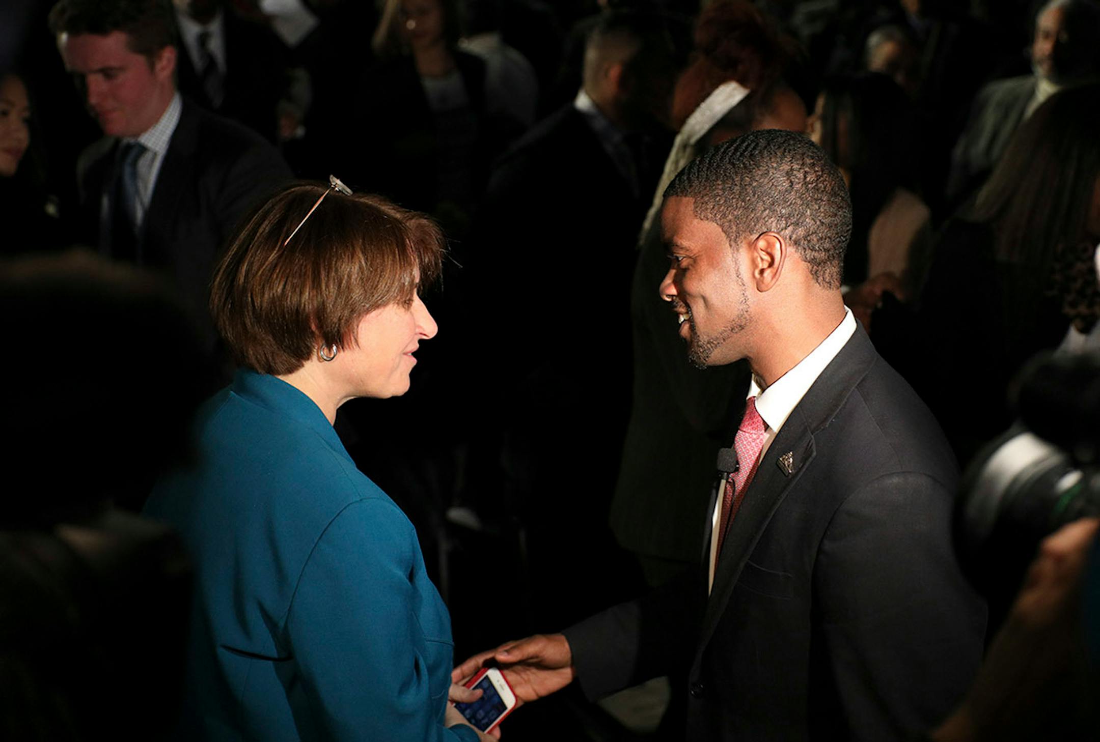 Melvin Carter greeted U.S. Sen. Amy Amy Klobuchar after taking the oath of office during his swearing in ceremony as St. Paul mayor.