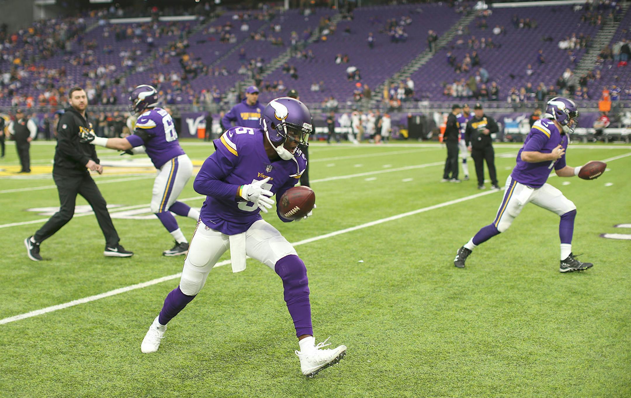 Vikings quarterback Teddy Bridgewater (5), foreground, and fellowquarterback Case Keenum (7) warmed up before Sunday's game against the Bengals Sunday at U.S. Bank Stadium in Minneapolis.
