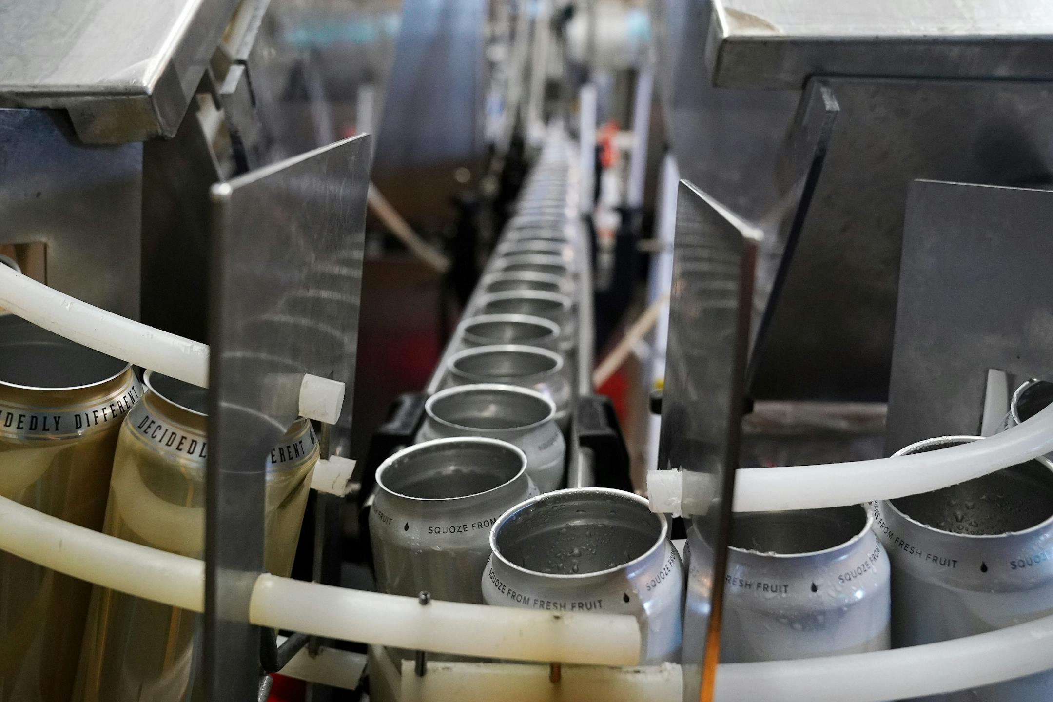 Empty cans traveled down line for Sociable Cider Werks' Squoze Hard Seltzer Thursday morning in northeast Minneapolis.