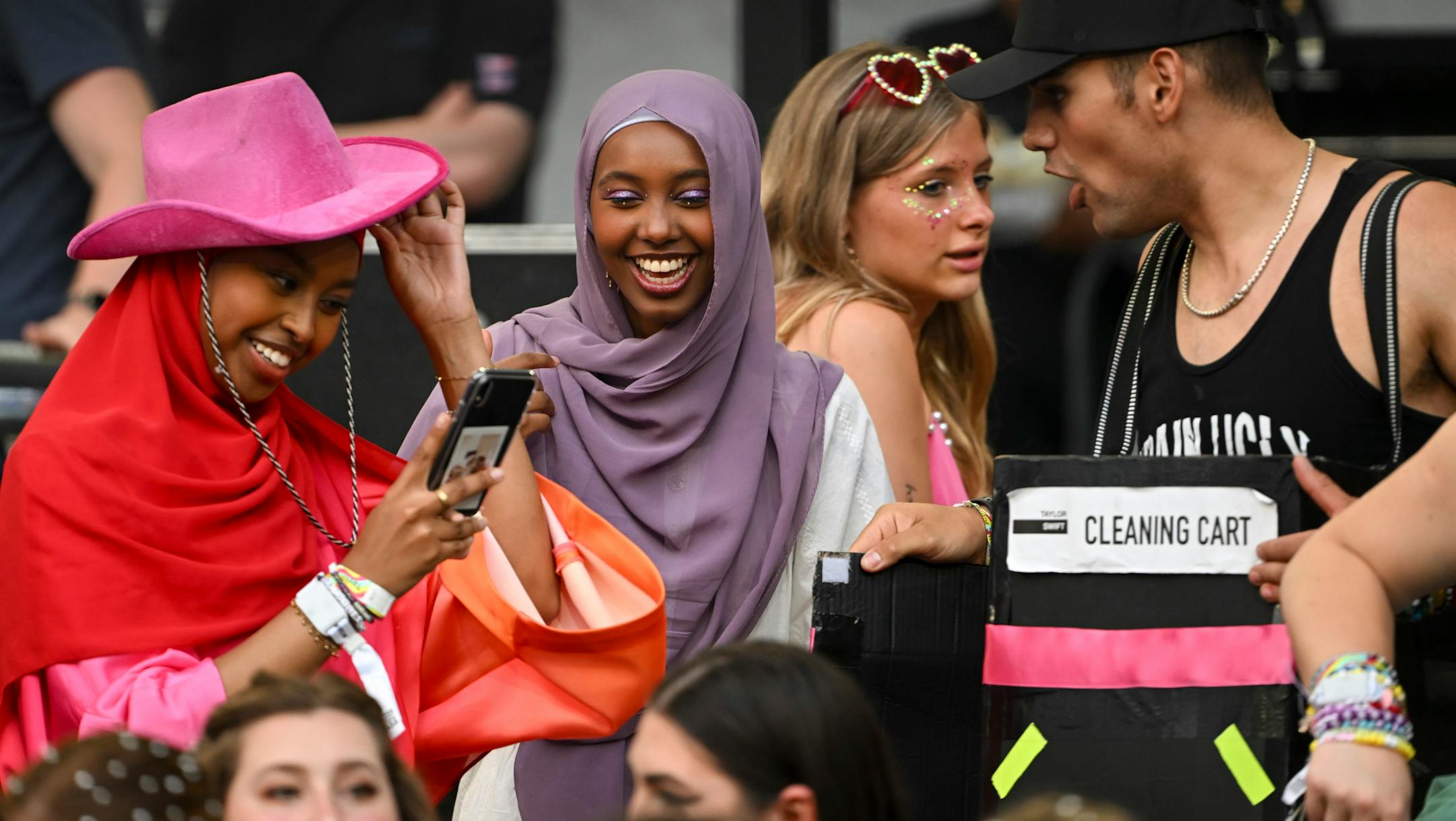 Taylor Swift fans interact before the start of Swift's concert Friday, June 23, 2023, at US Bank Stadium in Minneapolis, Minn.