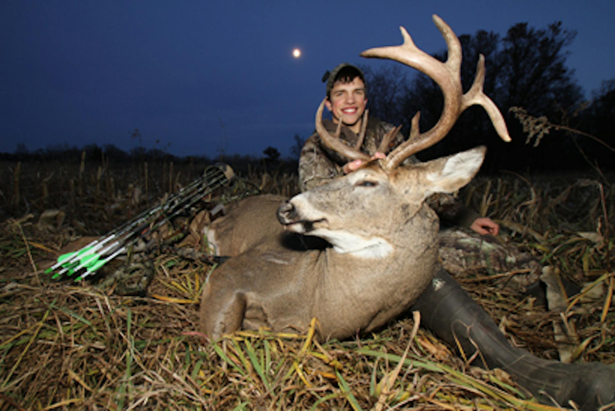 Brody Boese of Elk River with a trophy drop-tine buck he arrowed in November
