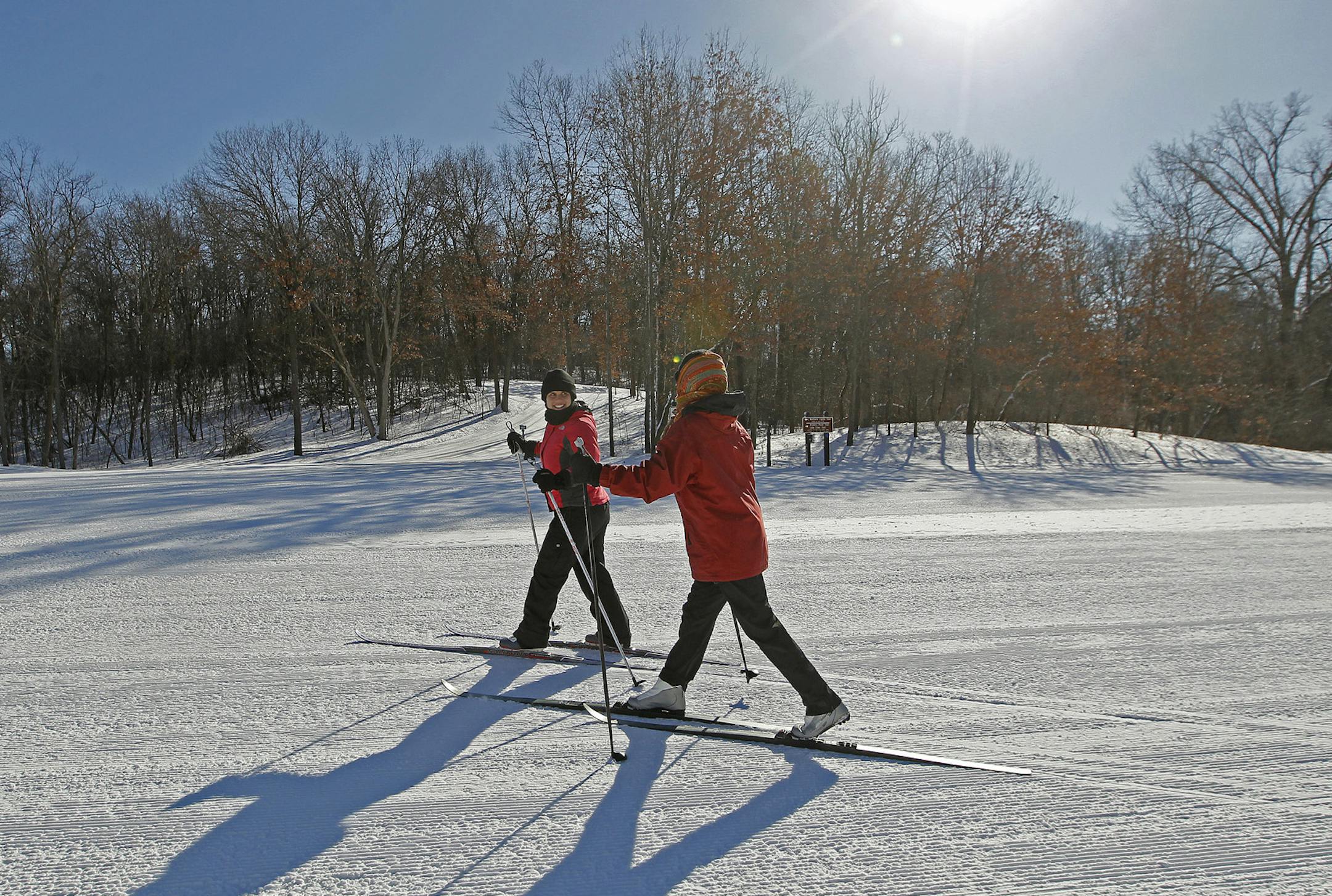Carrie Lehenbauer, cq, left of St. Paul, and Kay Provine of Lake Elmo, made their way to one of the ski trails at the Nordic Center at Lake Elmo Park Reserve, Tuesday, February 2, 2014. (ELIZABETH FLORES/STAR TRIBUNE) ELIZABETH FLORES • eflores@startribune.com