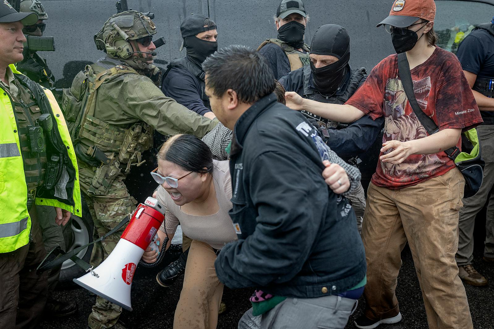 People protest law enforcement outside Las Cuatro Milpas restaurant in Minneapolis on Tuesday.
