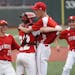 Benilde-St. Margaret pitcher Dylan Drees (8) was swarmed by his teammates after they defeated Monticello 2-1 in a class 3a baseball semifinal.