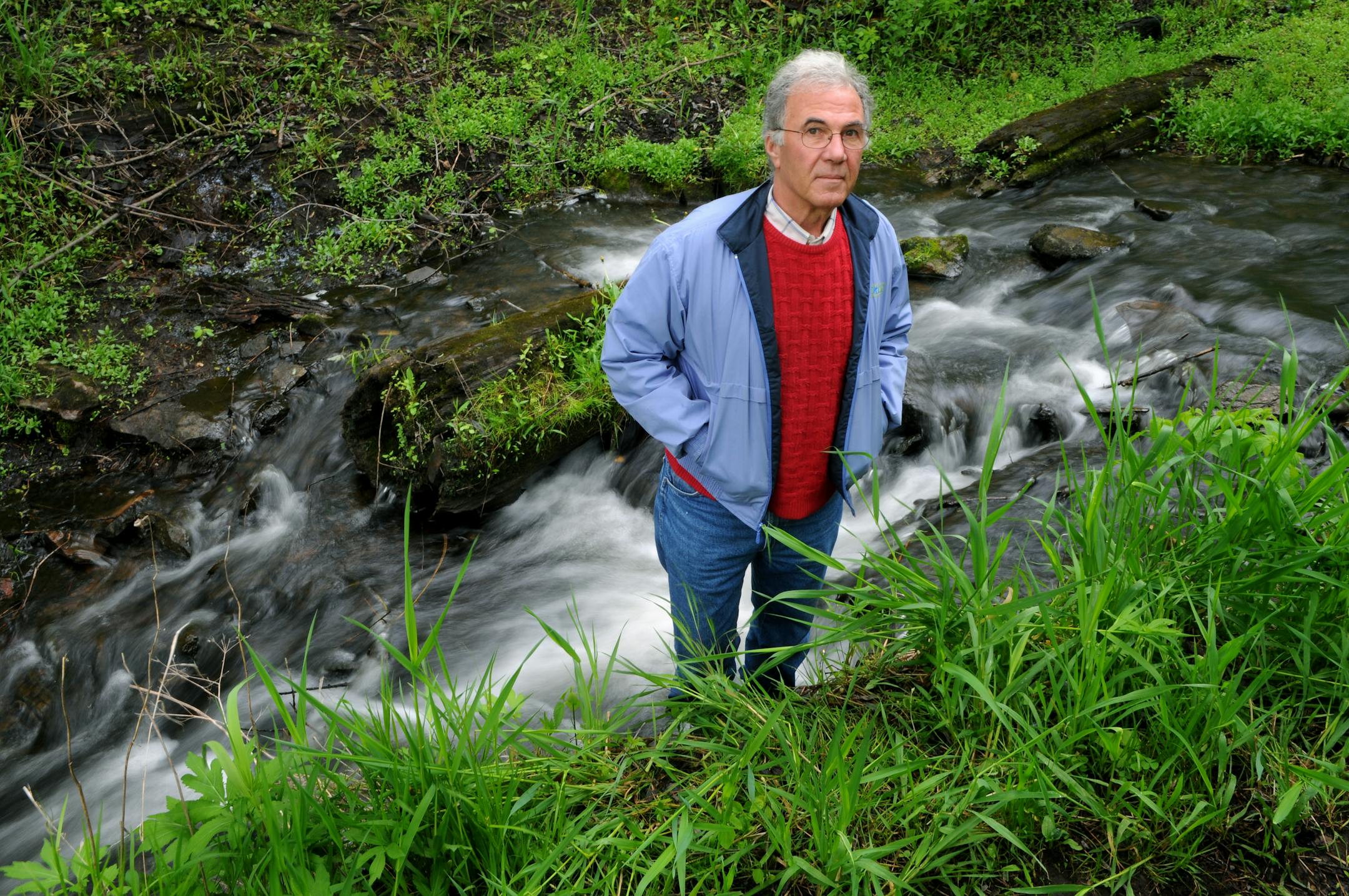 Jim Shaver, administrator of the Carnelian-Marine-St. Croix Watershed District, stood next to Mill Stream, among those that frequently carry sediment into the St. Croix River.