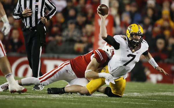 Minnesota Golden Gophers quarterback Mitch Leidner (7)was tackled by Wisconsin Badgers linebacker Vince Biegel (47) in the third quarter Saturday Nove