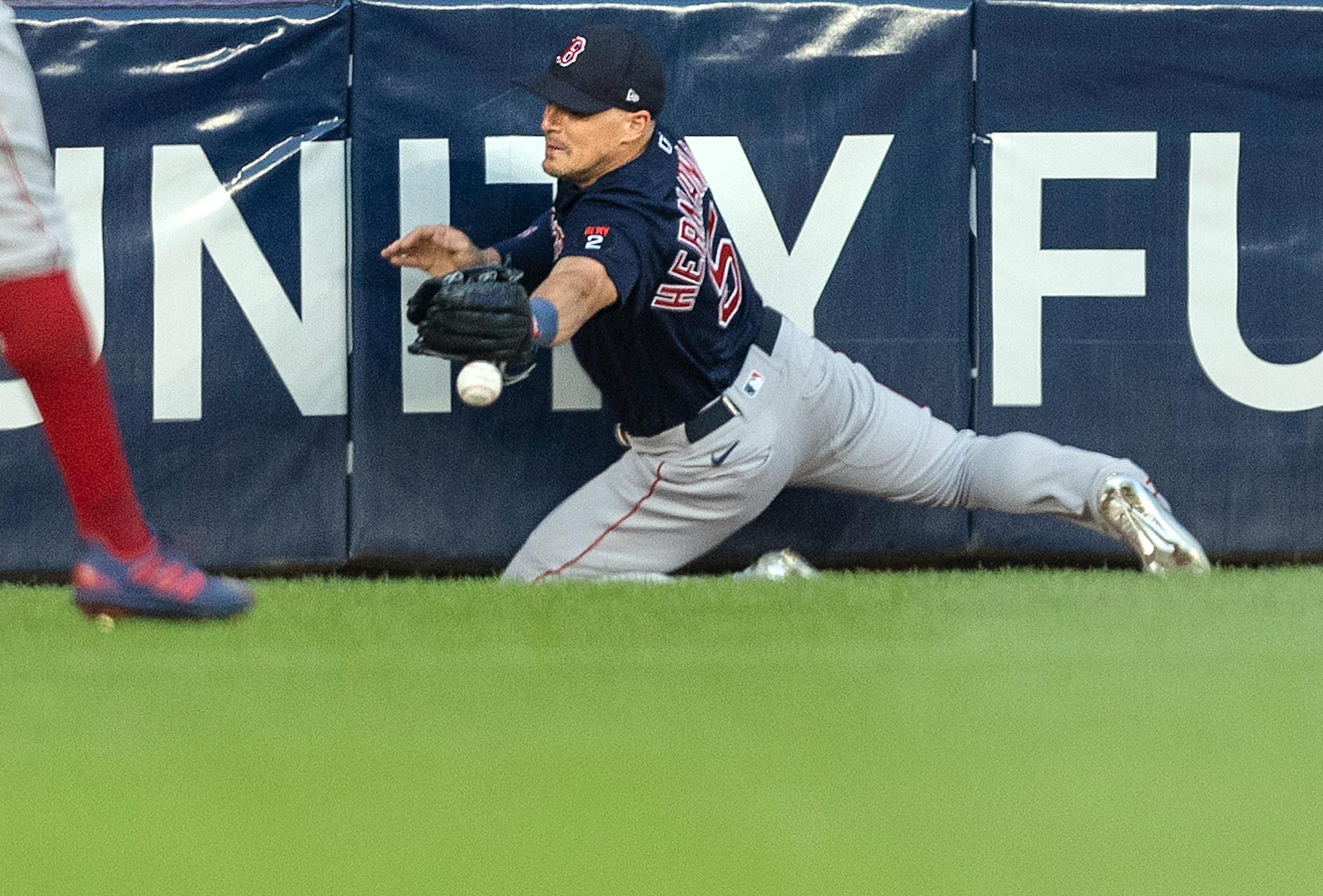 Boston Red Sox centerfielder Kike Hernandez (5) can't hang on to a ball hit by Jose Miranda of the Minnesota Twins for a double in the third inning.