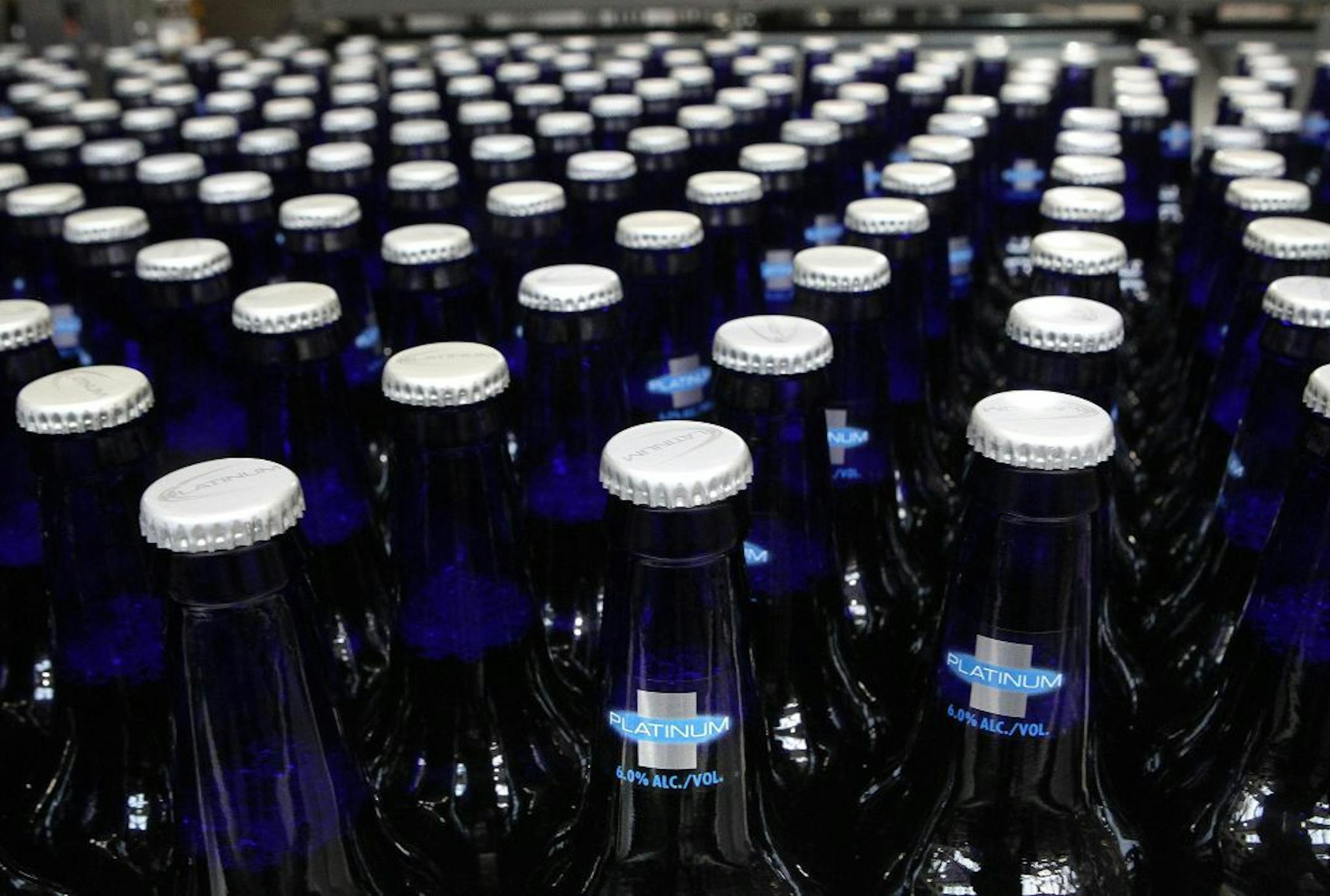 Bottles of Bud Light Platinum move along during the packaging process at Anheuser-Busch brewery in downtown St. Louis, Mo.