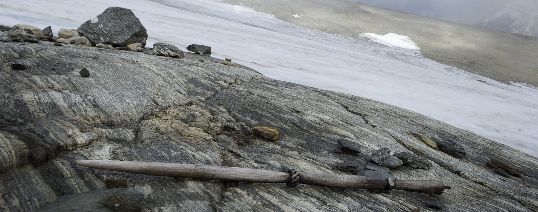 In a photo provided by Espen Finstad/Secretsoftheice.com, a distaff as it was found in the mountain pass, close to the melting ice. Melting ice has receded from a mountain pass in Norway, unearthing pelts, shoes and stone structures from thousands of years ago. (Espen Finstad/Secretsoftheice.com via The New York Times) NO SALES; FOR EDITORIAL USE ONLY WITH NYT STORY SCI-VIKING-ARTIFACTS BY LIBELL AND HAUSER FOR APRIL 27, 2020. ALL OTHER USE PROHIBITED.