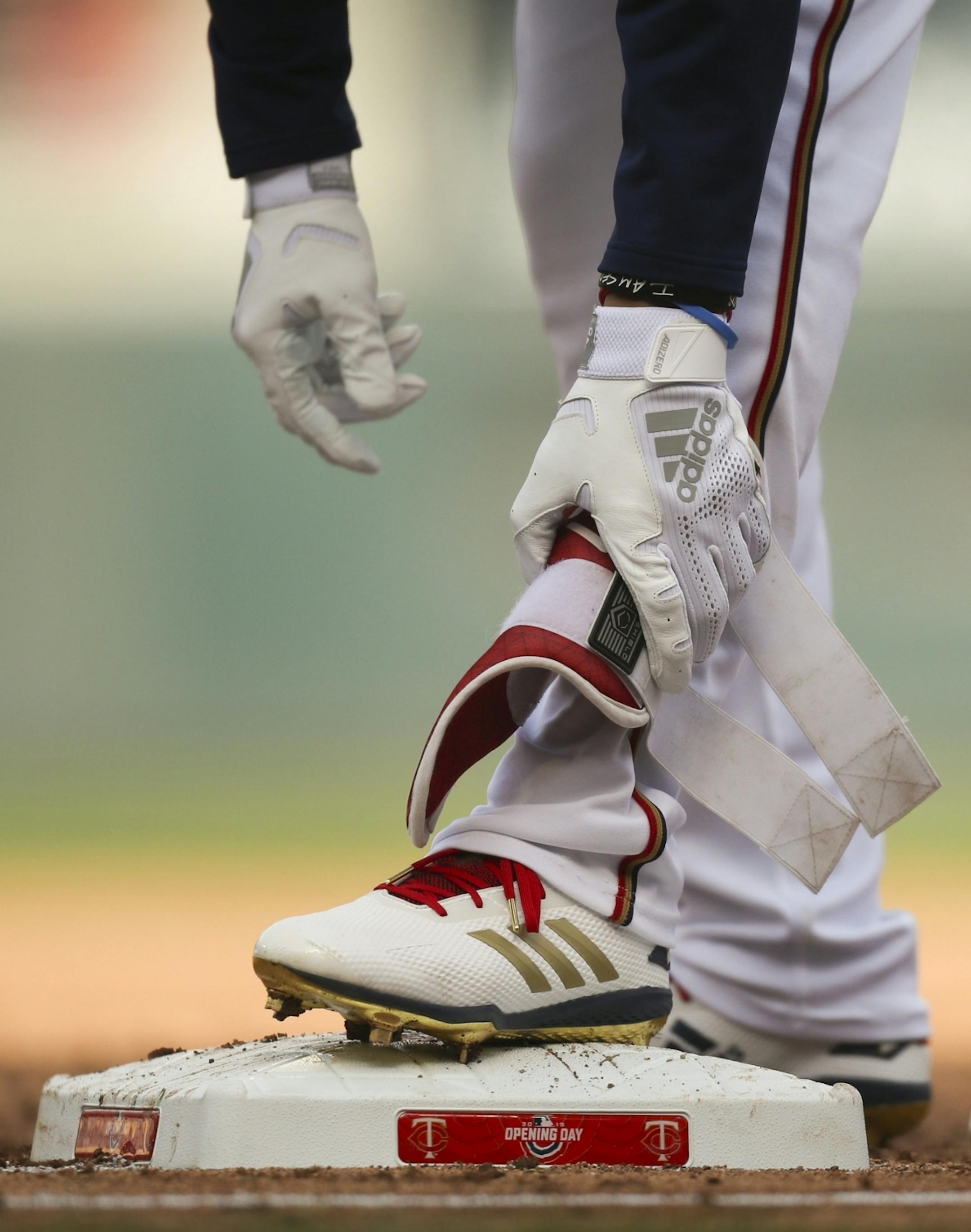 Minnesota Twins center fielder Byron Buxton took off his ankle protector at first base after his single to center field in the second inning.