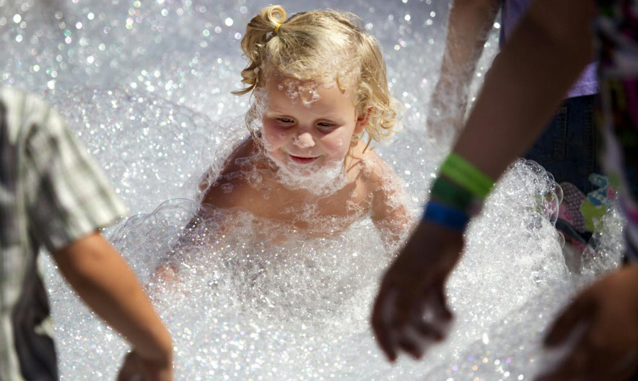 Lauren Smith, 2, of Hugo, enjoyed her romp in the Mr. Bubble attraction last year at the State Fair.