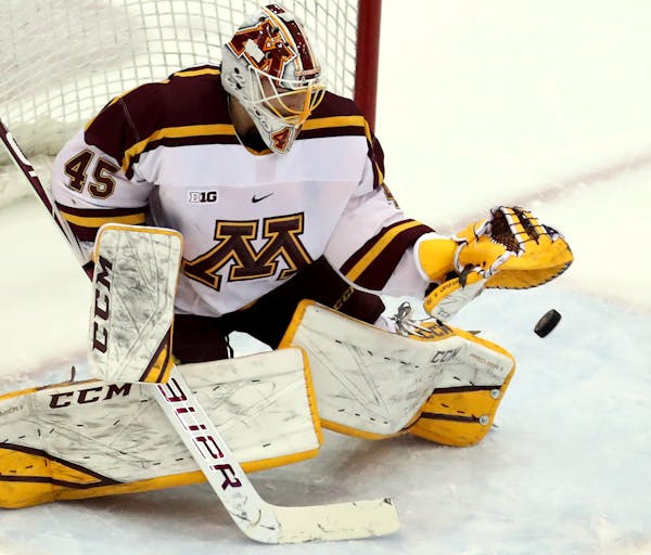 Jack LaFontaine made a save against the Wisconsin during a game in November.