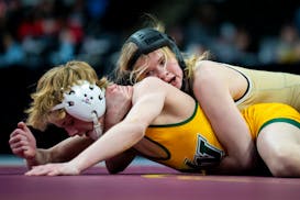 Northfield's Caley Graber (top) lost twice and won again Saturday, finishing fifth in her class in the boys bracket at the state meet.