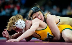Northfield's Caley Graber (top) lost twice and won again Saturday, finishing fifth in her class in the boys bracket at the state meet.