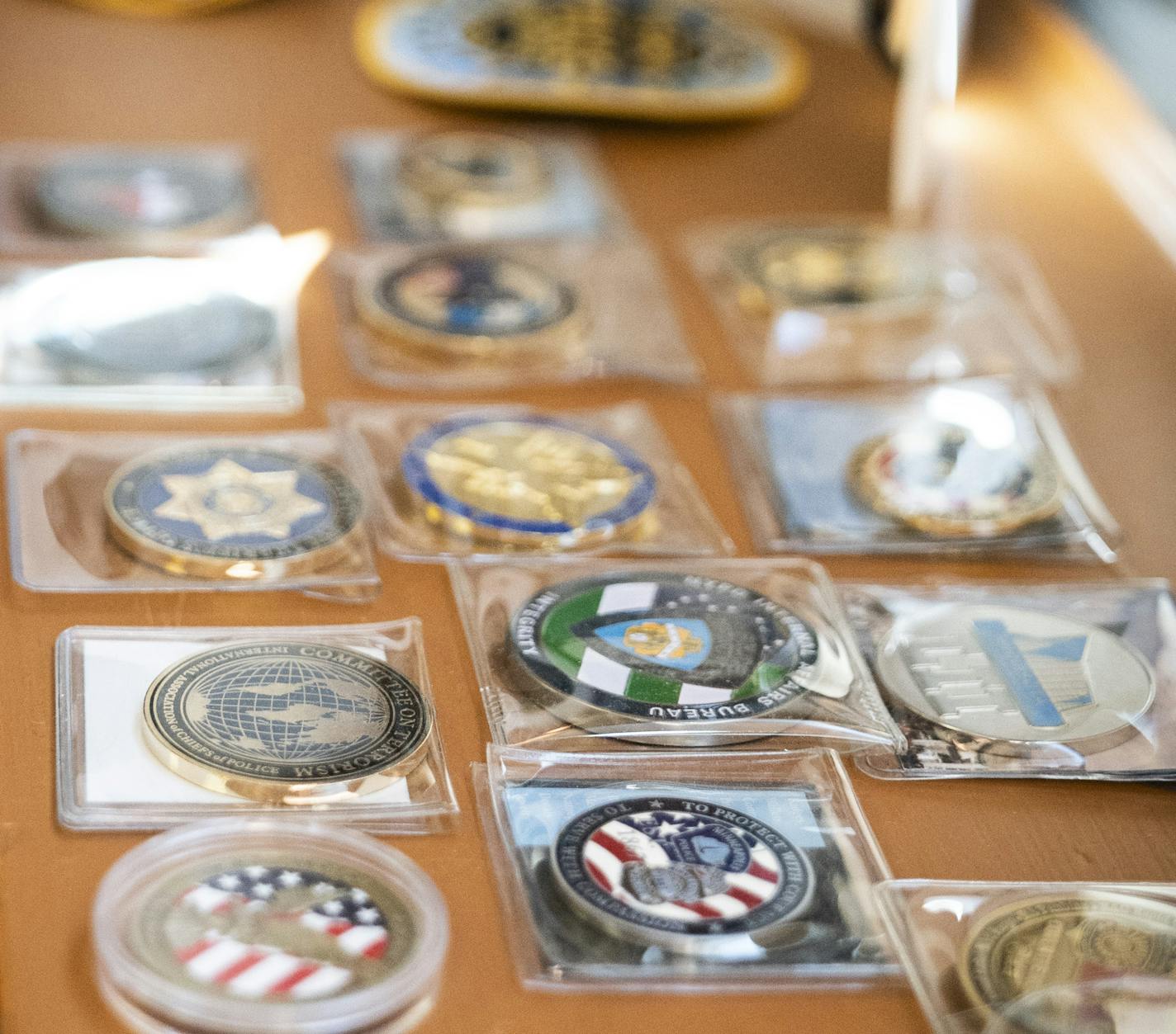 Deputy chief of investigations for the Minneapolis Police Department Erick Fors has multiple coins and metals he displays in his downtown office window ledge in Minneapolis, Minn., on Friday, March 13, 2020. ] RENEE JONES SCHNEIDER &#xa5; renee.jones@startribune.com ORG XMIT: MIN2003301013120553