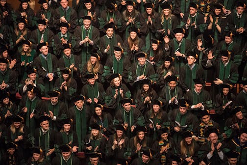 University of Minnesota Medical School graduates turned around to acknowledge friends and family in attendance at the May 6, 2016 commencement ceremony at the Northrop Auditorium.