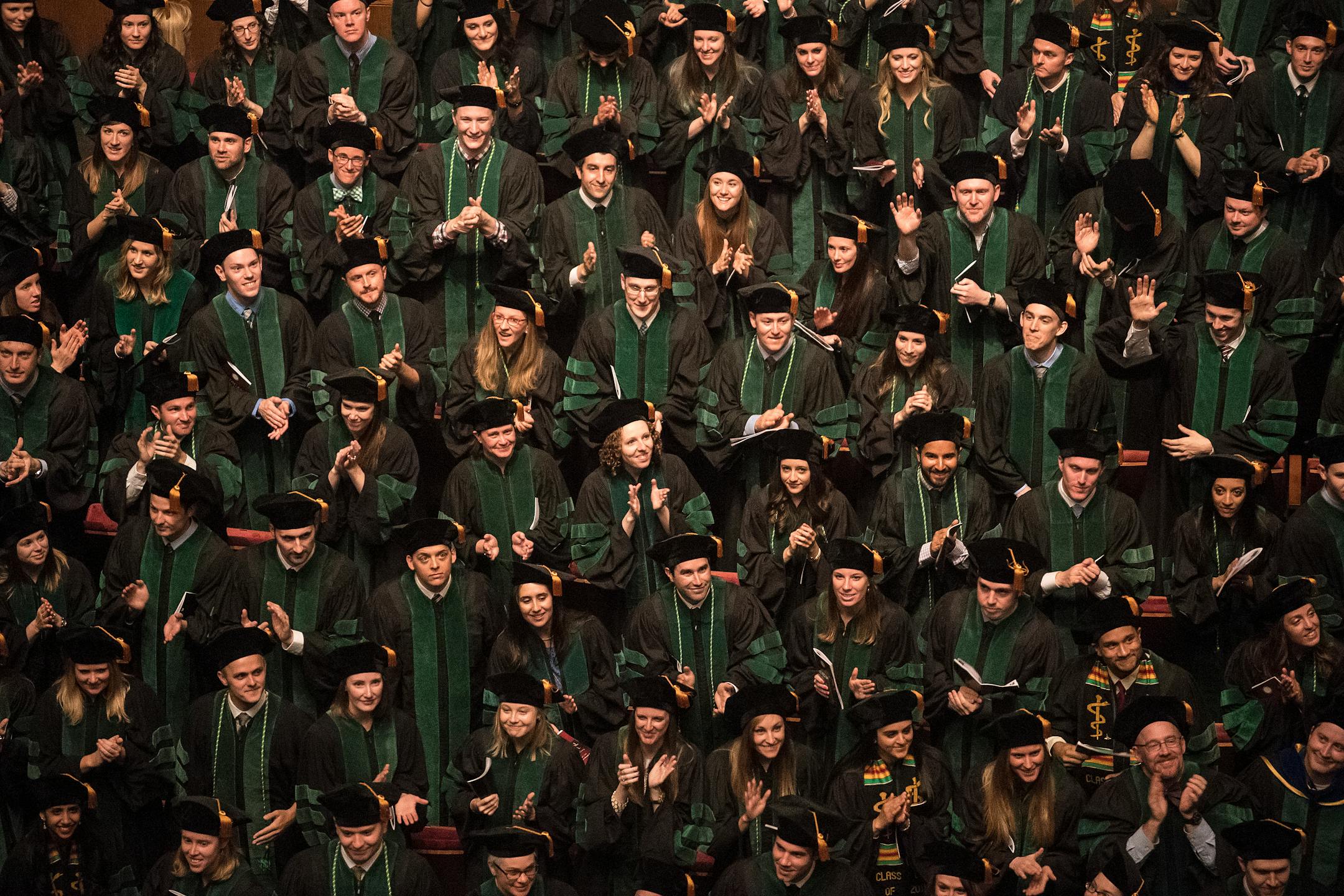 University of Minnesota Medical School graduates turned around to acknowledge friends and family in attendance at the May 6, 2016 commencement ceremony at the Northrop Auditorium.