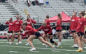 Stillwater warms up Thursday before its girls lacrosse state tournament semifinal.
