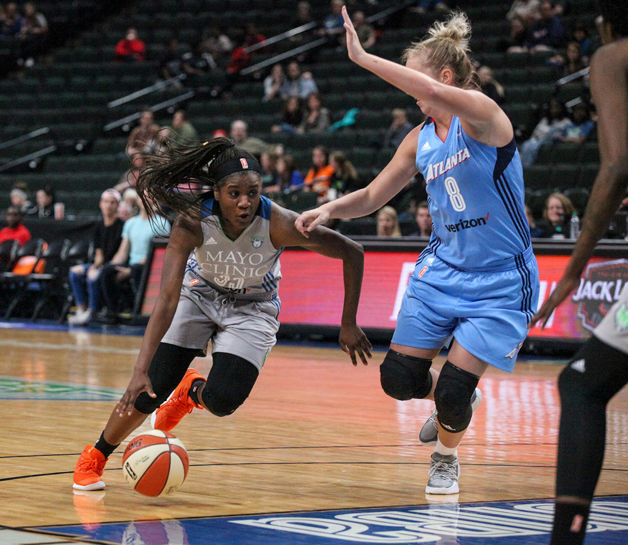 Minnesota Lynx guard Moriah Mack (35) goes around Atlanta Dream guard Carla Cortijo (8) in the second period.