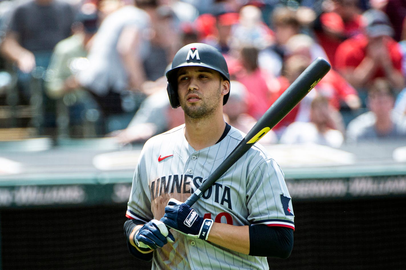 Minnesota Twins' Alex Kirilloff walks to the dugout after being called out on an automatic strike by umpire Scott Barry during the fourth inning of a baseball game against the Cleveland Guardians in Cleveland, Sunday, May 7, 2023. (AP Photo/Phil Long)