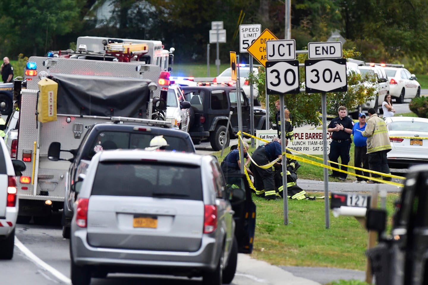 Emergency vehicles outside the Apple Barrel Country Store in Schoharie, N.Y., on Saturday, Oct. 6, 2018. A two-vehicle collision involving a limousine left 20 dead in the upstate New York town.