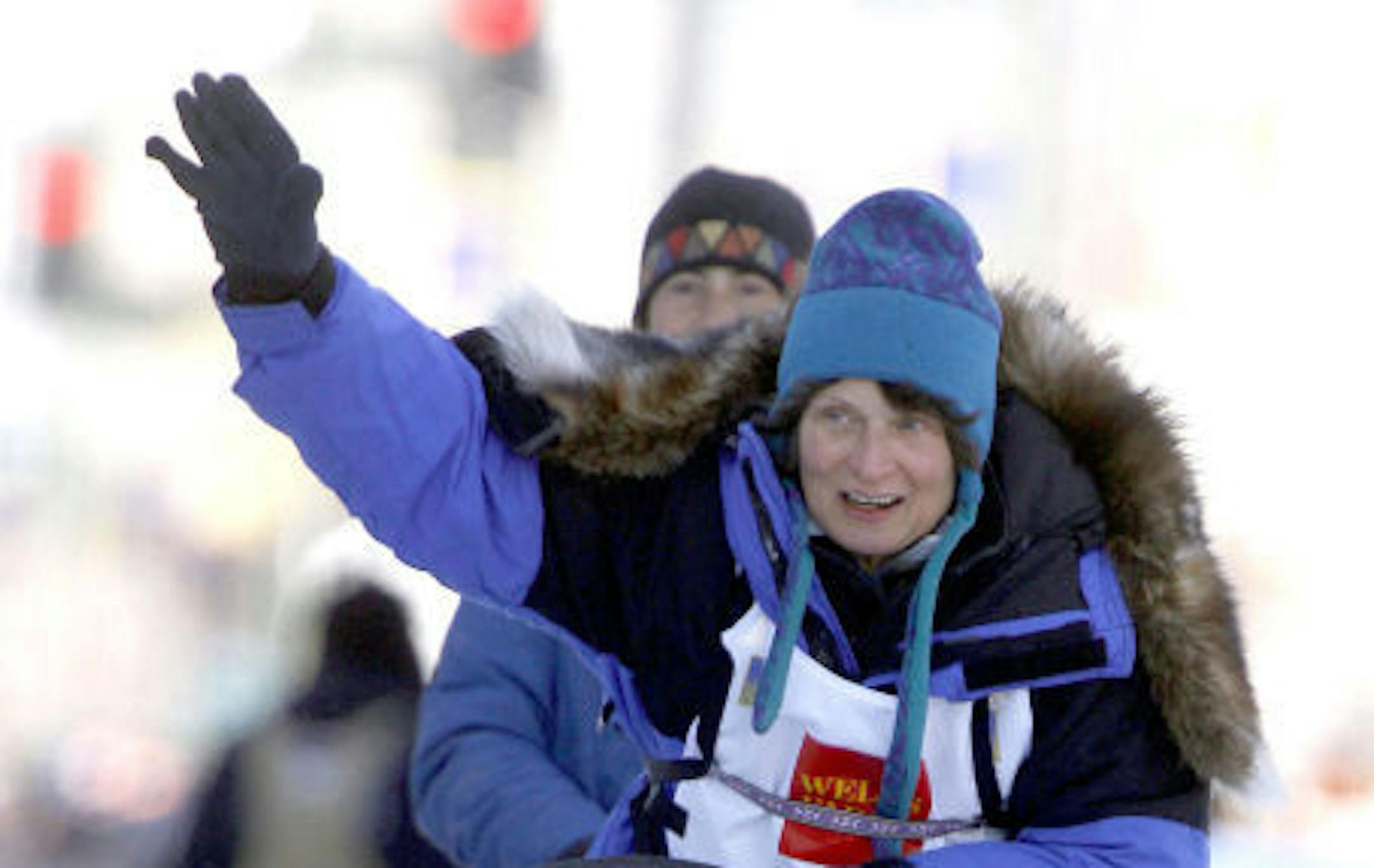 Cindy Gallea drives her team down Fourth Avenue in Anchorage Alaska, with Melanie Tofaro, from Port Murray N.J., in the sled, during the ceremonial start of the Iditarod Trail Sled Dog Race Saturday, March 7, 2009, in Anchorage, Alaska. The Minnesotan and St. Olaf graduate is racing again in 2013, at age 61, in her 11th Iditarod.
Credit: AP Photo/Al Grillo