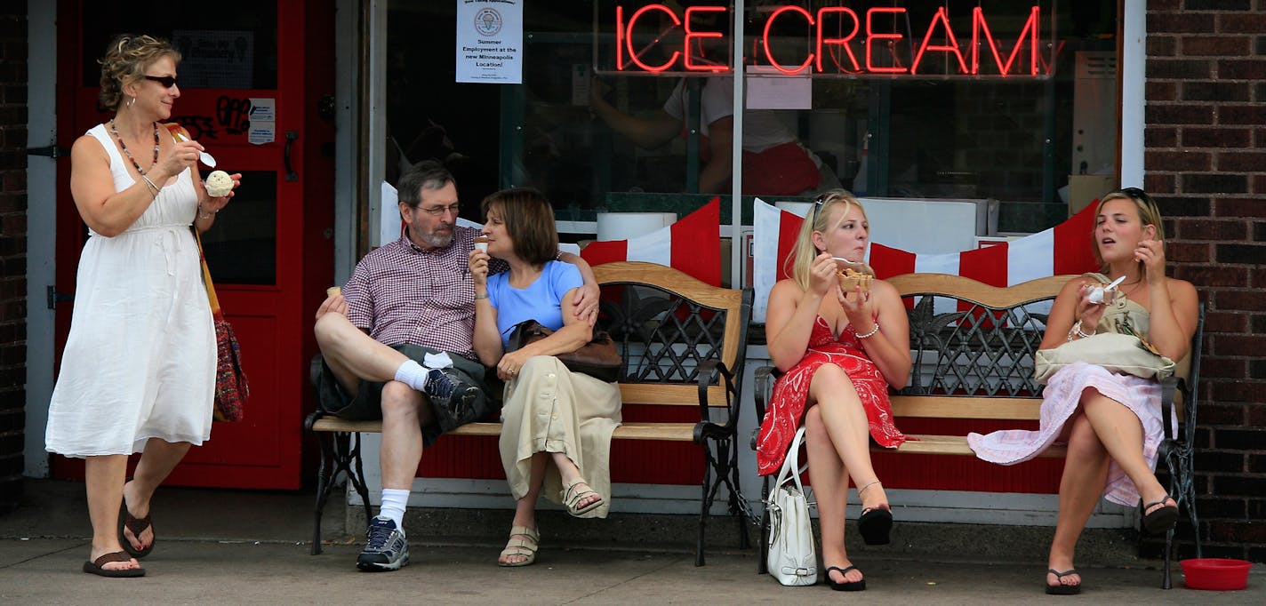 Steve Rice &#x2022; srice@startribune.com
St. Paul, 07/04/2007 - Outside the Grand Ole Creamery in St. Paul, Ellen Ziskin, from Minnetonka, coming out the door, Mike Metz and Hildy Bowbeer, Bloomington, sit on the left bench and Dana Steinman, red dress, and Shelby Steinman, both from Minnetonka, sit on the right bench enjoying ice cream on the 4th of July.