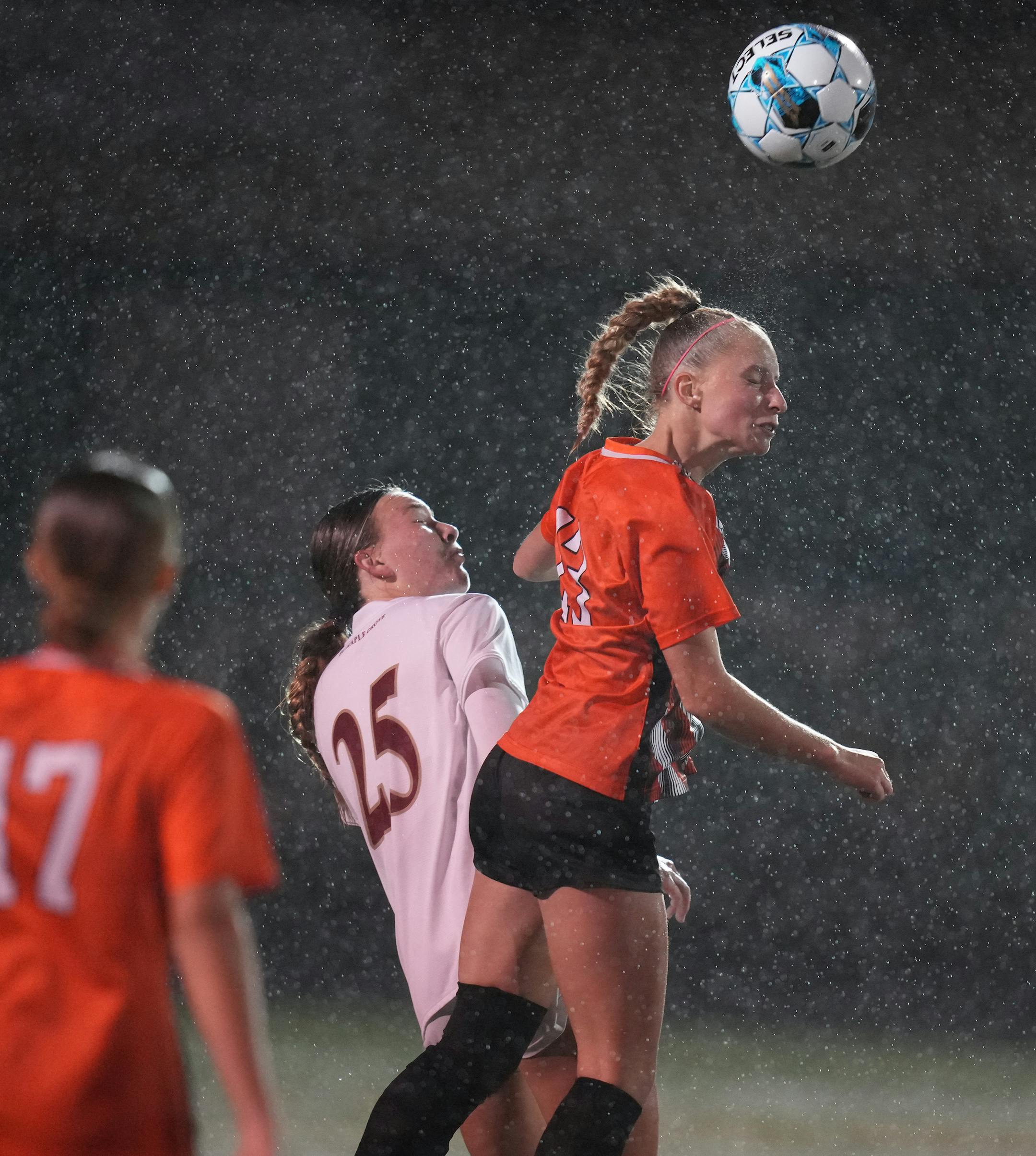 Kiera Gill (25) of Maple Grove watches as Camdyn Bachmeier (13) of White Bear.