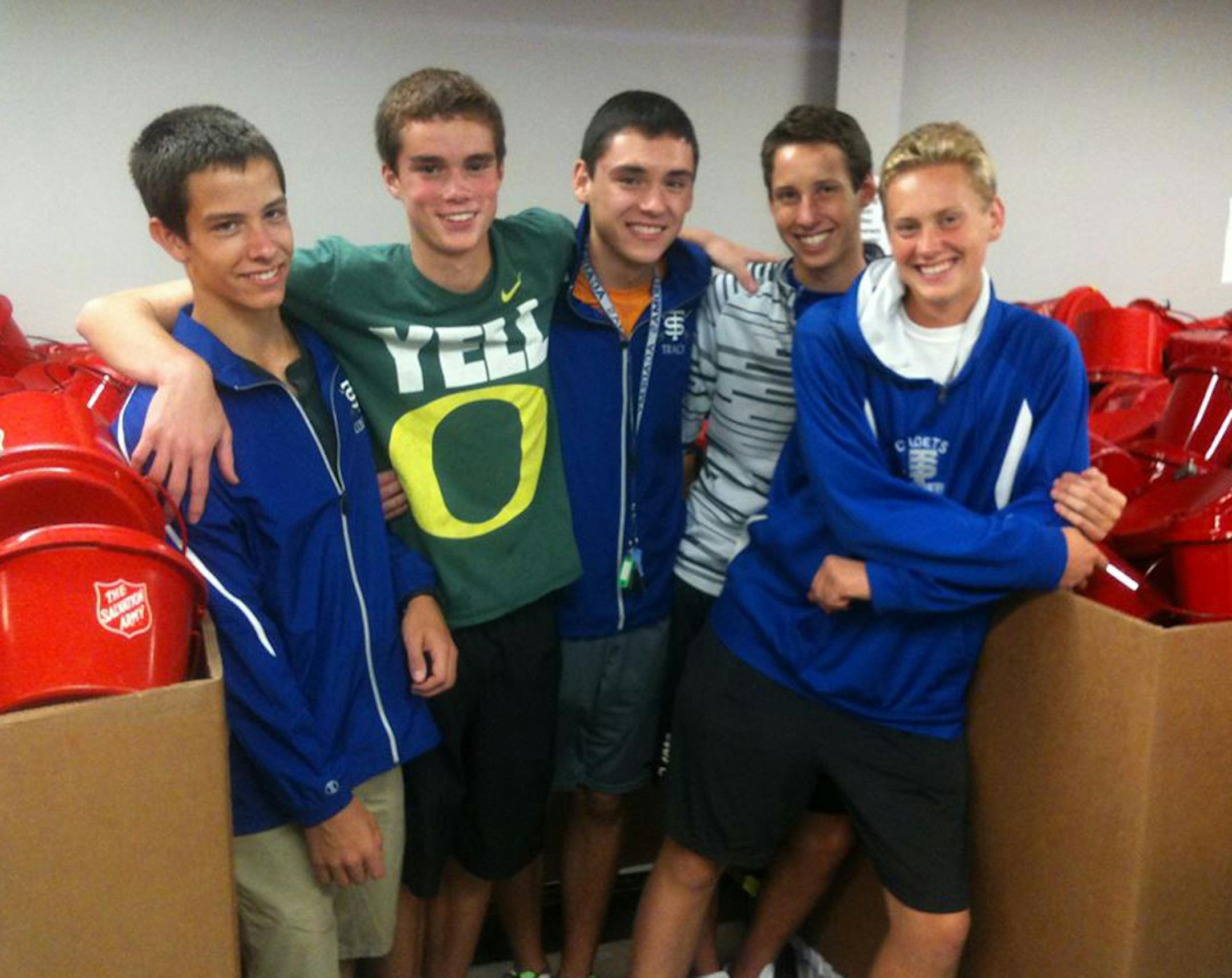Courtesy of Andrew Floeder Andrew Floeder (second from right) and a group of St. Thomas Academy cross country friends cleaned up hundreds of Salvation Army red kettles in August 2013.