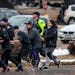 Shoppers are evacuated from a King Soopers grocery store after a gunman opened fire on March 22, 2021 in Boulder, Colorado. Dozens of police responded