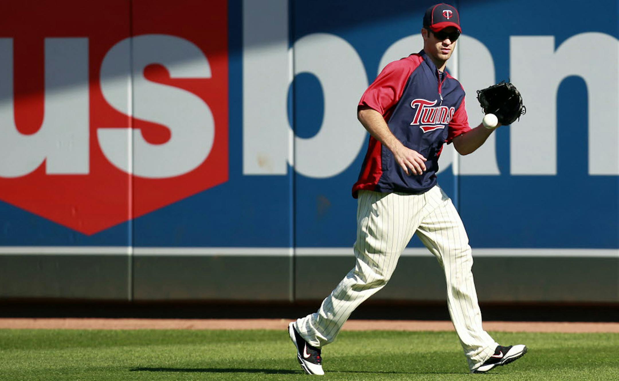 Joe Mauer practiced in right field during before Thursday night's game.