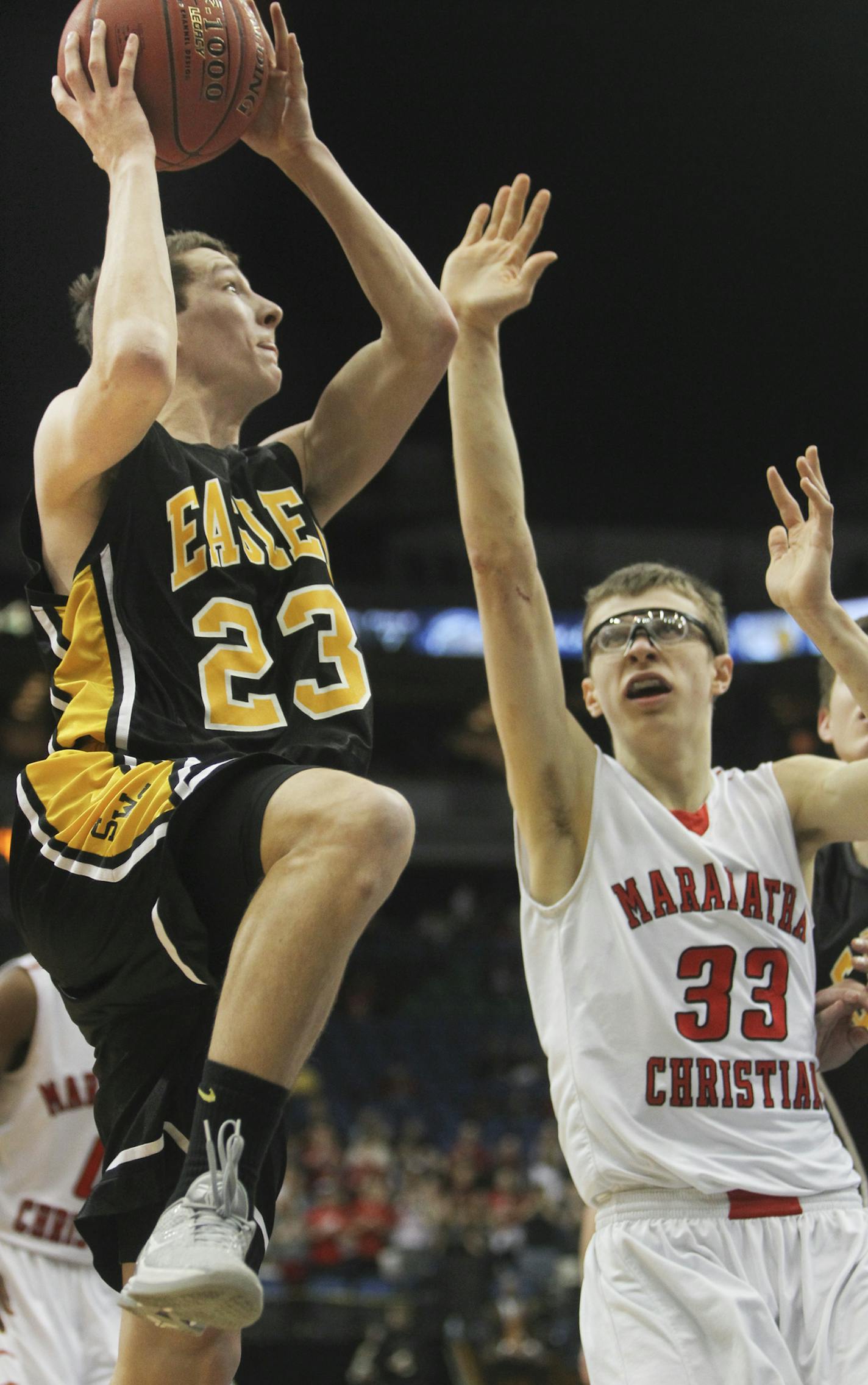 Southwest Minnesota Christian's Dominic Nibblelink drives for a hoop past Maranatha Christian's Jeremiah Hanson during the second half of Southwest's during his 81-73 win over Maranatha Christianin the boys state high school class 1A basketball finals Saturday, March 23, 2013, at the Target Center in Minneapolis, MN.]] (DAVID JOLES/STARTRIBUNE) djoles@startribune.com boys state high school class 1A basketball finals Saturday, March 23, 2013, at the Target Center in Minneapolis, MN.**Dominic Nibb