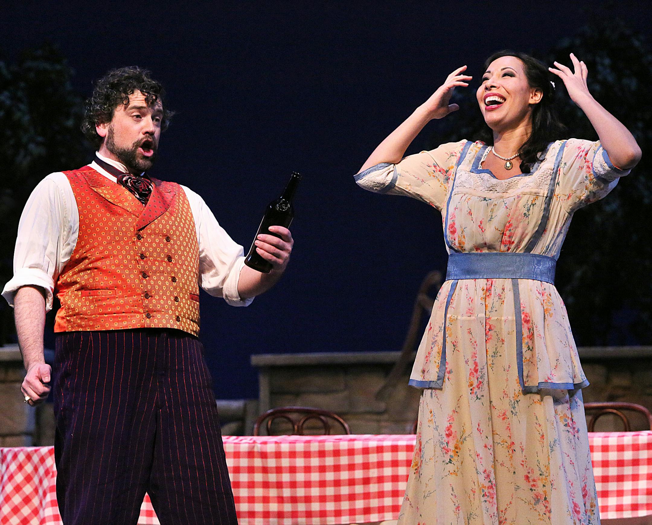 Andrew Wilkowske as Dr. Dulcamara and Nicole Cabell as Adina in the Minnesota Opera production of The Elixir of Love.