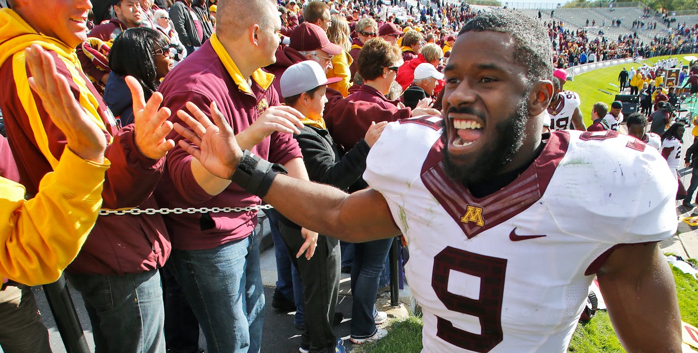 Minnesota Gophers vs. Northwestern Wildcats football. Minnesota won 20-17. Gophers James Manuel, who intercepted a Wildcat pass and ran it back for a second half touchdown, celebrated with Minnesota fans at the end of the game. . (MARLIN LEVISON/STARTRIBUNE(mlevison@startribune.com)