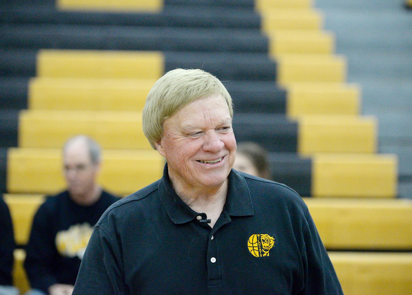 Mike Dreier wore a grin Dec. 10, the day he broke Minnesota's record for high school basketball coaching victories.