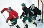 Minnesota Wild defenseman Calen Addison (59) skated against right wing Mats Zuccarello (36) in a three on three match during practice Friday. ] ANTHON