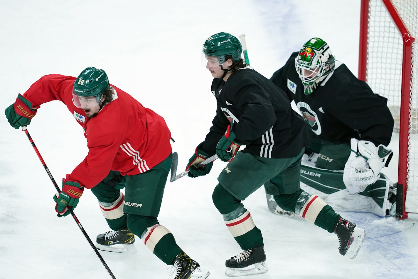 Minnesota Wild defenseman Calen Addison (59) skated against right wing Mats Zuccarello (36) in a three on three match during practice Friday. ] ANTHONY SOUFFLE • anthony.souffle@startribune.com