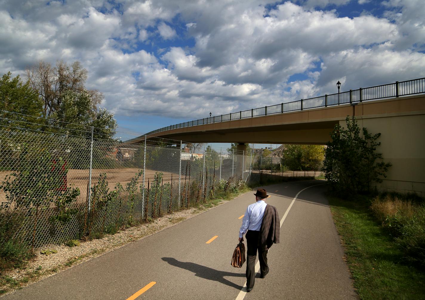 Southwest LRT officials will lead a tour of the area where a 10-foot wall is proposed. Here, a pedestrian walks along the trail during a tour Southwest LRT tour Thursday, Sept. 28, 2017, in Minneapolis, MN.] DAVID JOLES &#xef; david.joles@startribune.com Controversy continues to stir over a proposed 10-foot concrete wall that will separate freight and light trains along the Southwest LRT route in Minneapolis. In an effort to appease its critics, the Met Council is conducting tours along the $20